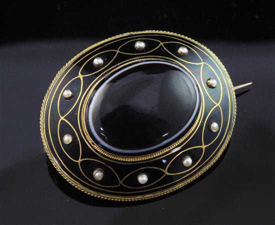 A Victorian gold, enamel, seed pearl and banded agate oval pendant/brooch, 2in.